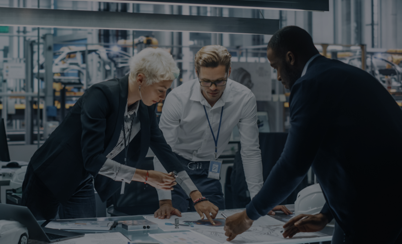 Employees working at a table with computers