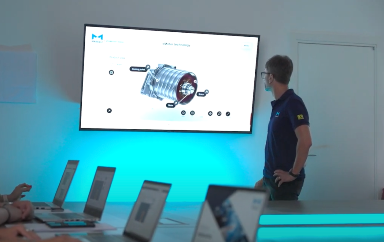 Marelli engineer giving a presentation on motor technology to a class