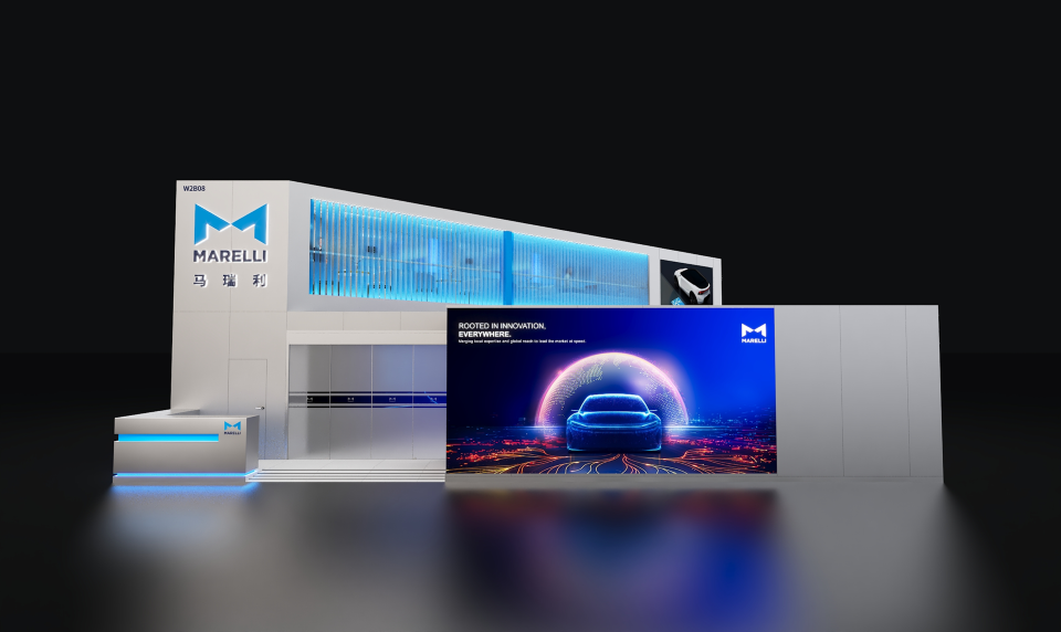 Trade show booth with Marelli branding, featuring a modern white display structure and a large digital screen showing a stylized blue car graphic on a dark background.
