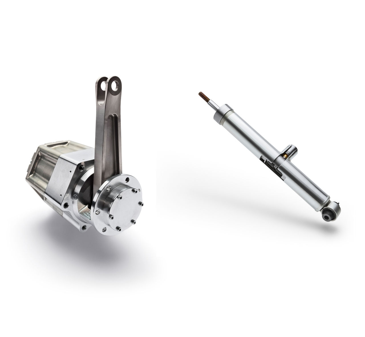Full-active electromechanical actuator and a semi-active damper shown as two separate components on a white background.